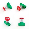 Green PVC pipe fitting with red valve handles Royalty Free Stock Photo