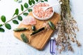 Green Quartz Facial Roller. Bath Salts, Lavender Oil, and Dried Lavender on the table Royalty Free Stock Photo