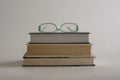 Eye glasses on top of stack of books Royalty Free Stock Photo