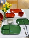 Green ceramic plates on a table in a restaurant. Selective focus. Royalty Free Stock Photo