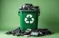 Green recycle bin full of obsolete e-waste. Electronic devices include keyboards, monitors, peripherals. Concept of e-waste Royalty Free Stock Photo
