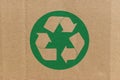 Green recycle symbol on cardboard background Royalty Free Stock Photo