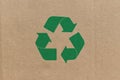 Green recycle symbol on cardboard background Royalty Free Stock Photo