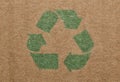 Green recycle symbol printed on a cardboard box. Royalty Free Stock Photo