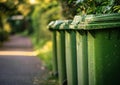 Green recycling bins in row. A green garbage bins