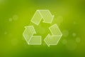 Recycling symbol on a green background Royalty Free Stock Photo