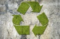 Green recycling sign on a concrete wall Royalty Free Stock Photo