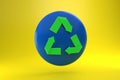 green recycling sign on round blue dialog box