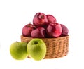 Green and red apples in a wicker baskets Royalty Free Stock Photo