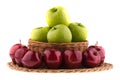Green and red apples in a wicker baskets. Royalty Free Stock Photo