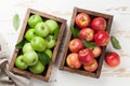 Green and red apples in wooden box Royalty Free Stock Photo