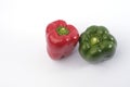 Green and red bell pepper on white background Royalty Free Stock Photo