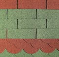 Green and red bitumen shingles samples.