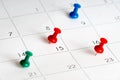 Green red blue pins on calendar Royalty Free Stock Photo