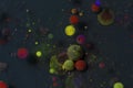 Colorful bubbles, green, red, blue spheres on dark background Royalty Free Stock Photo