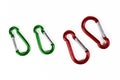 Green and red carabiner snap hooks on white background