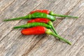 Green and red chilli pepper on old wood Royalty Free Stock Photo
