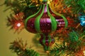 Green and Red Christmas Bulb closeup on a Christmas tree Royalty Free Stock Photo
