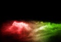 Green red color powder explosion cloud  on black background.Green red dust splash on dark background Royalty Free Stock Photo