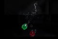 Green and red dice dropped into water Royalty Free Stock Photo