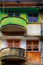Green and red at facade building, antique flat with old architecture Royalty Free Stock Photo