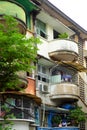 Green and red at facade building, antique flat with old architecture Royalty Free Stock Photo