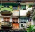 Green and red at facade building, antique flat with old architecture