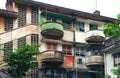 Green and red at facade building, antique flat with old architecture