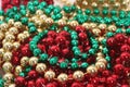 Green, Red and Gold Holiday Bead Decortations. Christmas Background