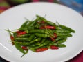 Green red Thai pepper, Chilli Padi, Capsicum annuum freshness on white plate vegetable food Royalty Free Stock Photo