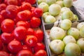 Green and red tomatoes on black plastic food crate at farmer market in Washington, USA Royalty Free Stock Photo