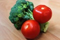 Green and red vegetables - broccoli and tomato Royalty Free Stock Photo