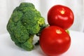 Green and red vegetables, delicious broccoli and tomatoes Royalty Free Stock Photo