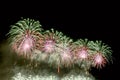 Green, red, white fireworks on dark background Royalty Free Stock Photo