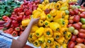 red yellow and green colored peppers for sale in market Royalty Free Stock Photo