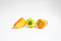 Green, red and yellow  pepper on white background. Royalty Free Stock Photo