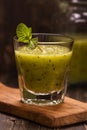 Green refreshing smoothie with kiwi, cucumber and apple. Toned image Royalty Free Stock Photo