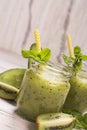 Green refreshing smoothie with kiwi, cucumber and apples Royalty Free Stock Photo