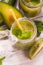 Green refreshing smoothie with kiwi, cucumber and apples Royalty Free Stock Photo