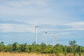Green renewable energy concept - wind generator turbines in sky Royalty Free Stock Photo