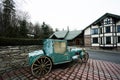 Green retro carriage handmade car against country house