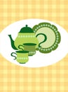 Green retro teapot, cups and plate