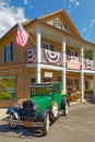 1929 green retro, vintage two door Ford pickup truck at retro general store