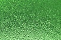 Green ribbed glass surface. Abstract background.