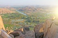 Green rice fields, palms and river Tungabhadra in the village of Hampi. Palm trees, the sun, rice fields. Tropical exotic Royalty Free Stock Photo