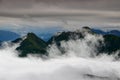 Green ridges in clouds, Carnic Alps Friuli Venezia Giulia Italy Royalty Free Stock Photo