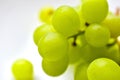 Green ripe grapes macrophotography on a white background Royalty Free Stock Photo