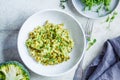 Green risotto with broccoli, green peas and sprouts in white plate, top view. Healthy vegan food concept Royalty Free Stock Photo