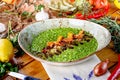 Green risotto with pumpkin slices on a plate Royalty Free Stock Photo