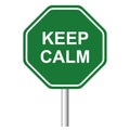 Green road sign with phrase Keep Calm on white background Royalty Free Stock Photo